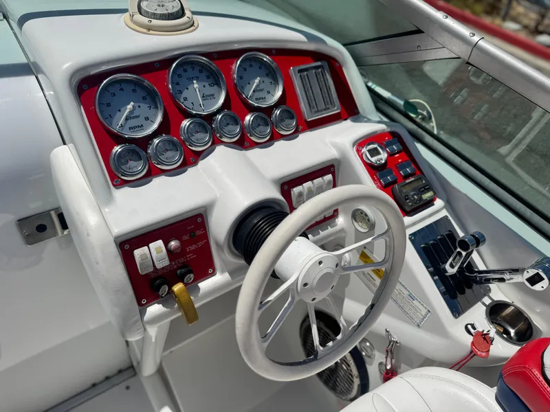 Slide: The Image of Dashboard of a 2006 Formula 292 boat with gauges and steering wheel. - 38