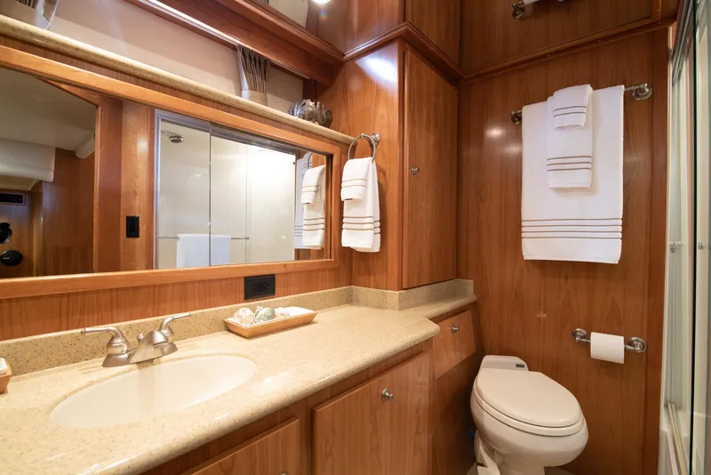 Slide: The Image of Luxurious bathroom in 2008 Navigator 5100 yacht with wood paneling and modern fixtures. - 13