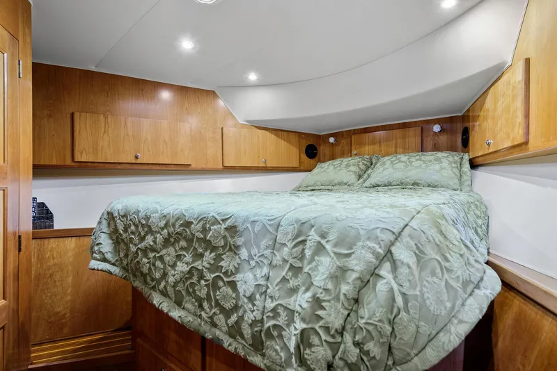 Slide: The Image of Luxurious bedroom in 2008 Navigator 5100 yacht with wood cabinetry and elegant bedding. - 14
