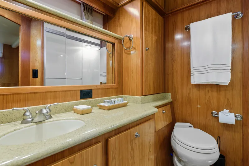 Slide: The Image of Luxurious bathroom in 2008 Navigator 5100 yacht with wood cabinetry and modern fixtures. - 16