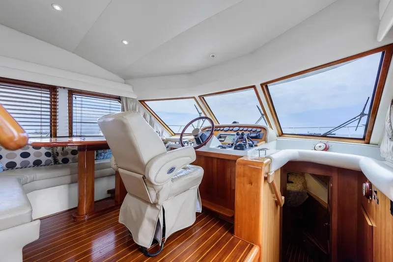 Slide: The Image of Luxurious 2008 Navigator 5100 yacht interior with wooden helm and panoramic windows. - 19