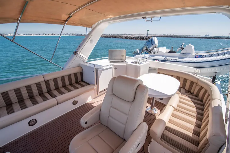 Slide: The Image of Luxurious 2008 Navigator 5100 yacht interior with seating, table, and ocean view. - 24