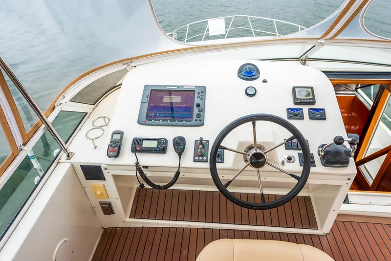 Slide: The Image of Helm of 2008 Navigator 5100 yacht with navigation equipment and steering wheel. - 33