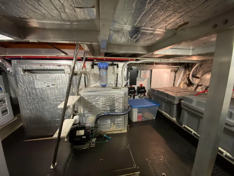 Slide: The Image of Engine room of 2008 Navigator 5100 yacht with insulated walls and mechanical equipment. - 34