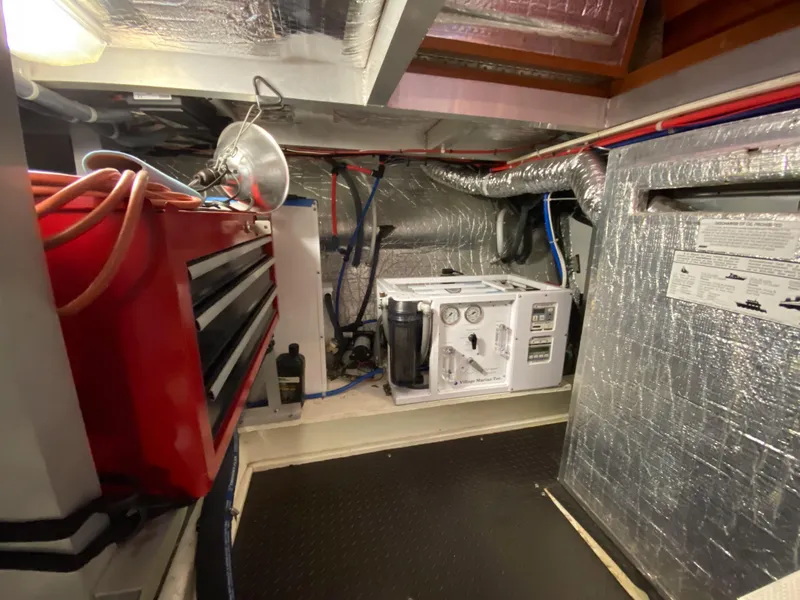 Slide: The Image of Engine room of a 2008 Navigator 5100 yacht with tools and equipment. - 35