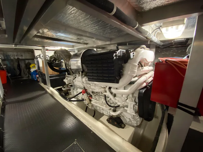 Slide: The Image of Engine room of 2008 Navigator 5100 yacht, featuring a powerful marine engine. - 36
