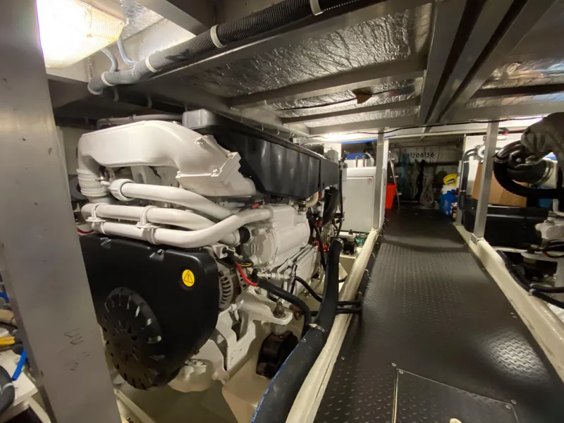 Slide: The Image of Engine room of 2008 Navigator 5100 yacht, showcasing machinery and equipment. - 37