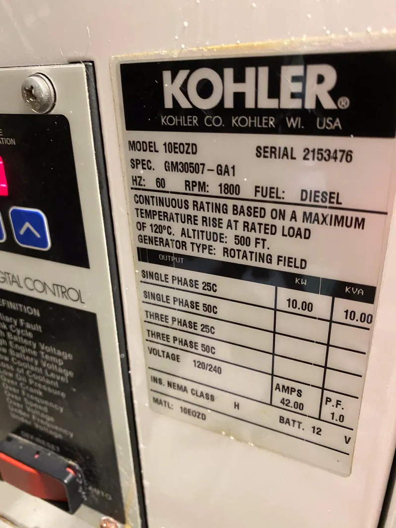 Slide: The Image of Kohler generator label with specifications and ratings, including model 10EOZD and serial 2153476. - 39