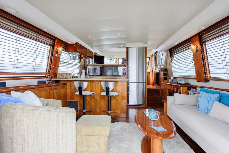 Slide: The Image of Luxurious interior of 2008 Navigator 5100 yacht with modern kitchen and comfortable seating. - 4