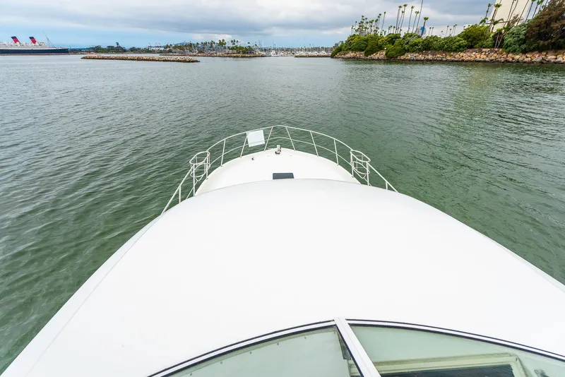 Slide: The Image of Bow view of 2008 Navigator 5100 yacht cruising in calm waters. - 42