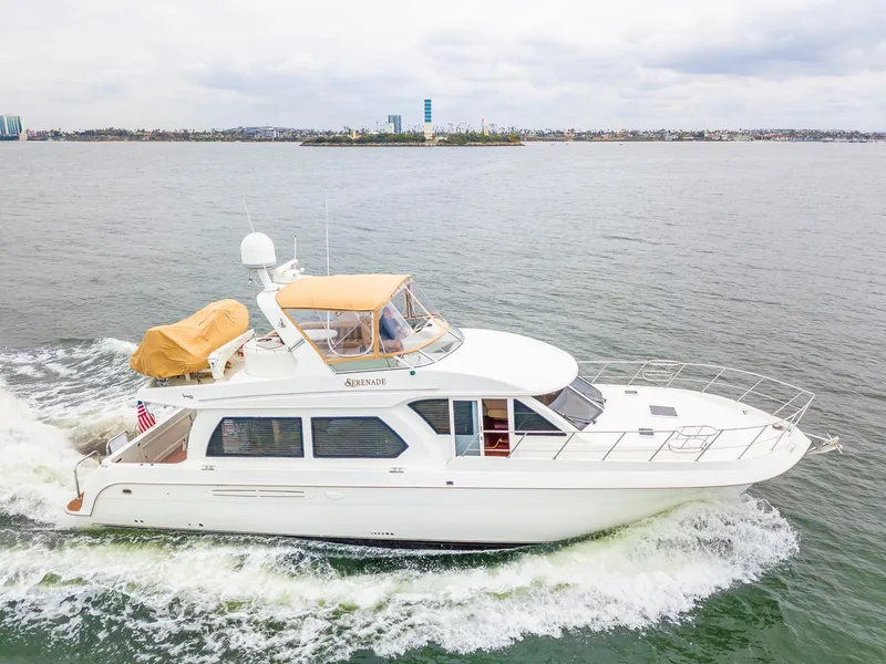 Slide: The Image of 2008 Navigator 5100 yacht cruising on open water, side view. - 44