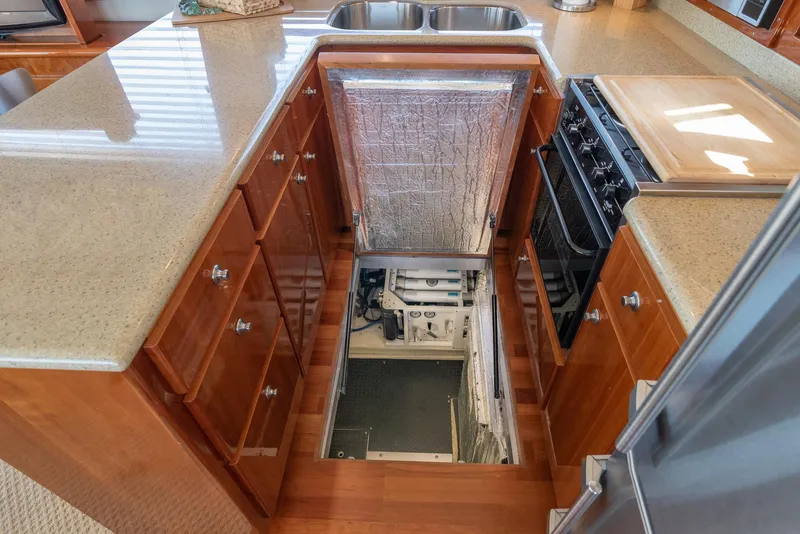 Slide: The Image of Kitchen area in a 2008 Navigator 5100 yacht with engine room access. - 9