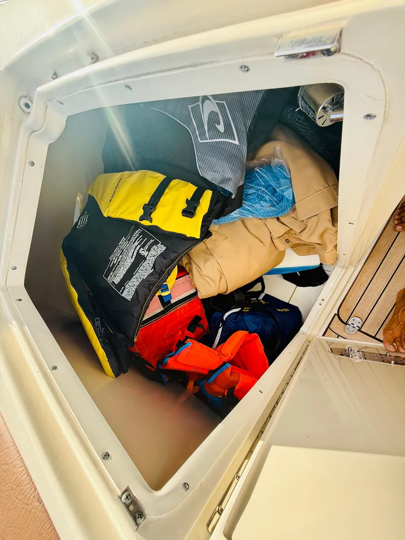Slide: The Image of Storage compartment on 2015 Chris-Craft Launch 32 with life jackets and gear. - 27