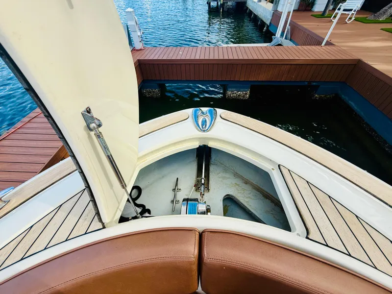 Slide: The Image of 2015 Chris-Craft Launch 32 bow storage area with open hatch, dockside view. - 31