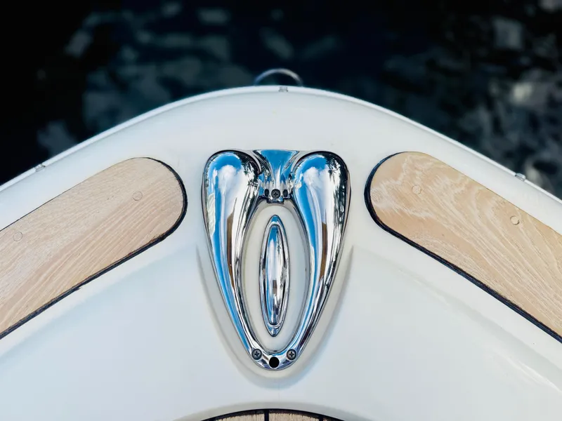 Slide: The Image of Bow detail of 2015 Chris-Craft Launch 32 with polished chrome and wood accents. - 32