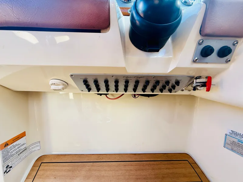Slide: The Image of Control panel of a 2015 Chris-Craft Launch 32 boat with switches and labels. - 46