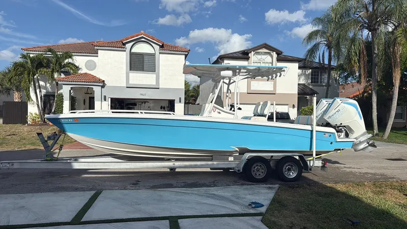 Slide: The Image of 2019 Concept 27' Open Deck boat on trailer in residential driveway. - 12