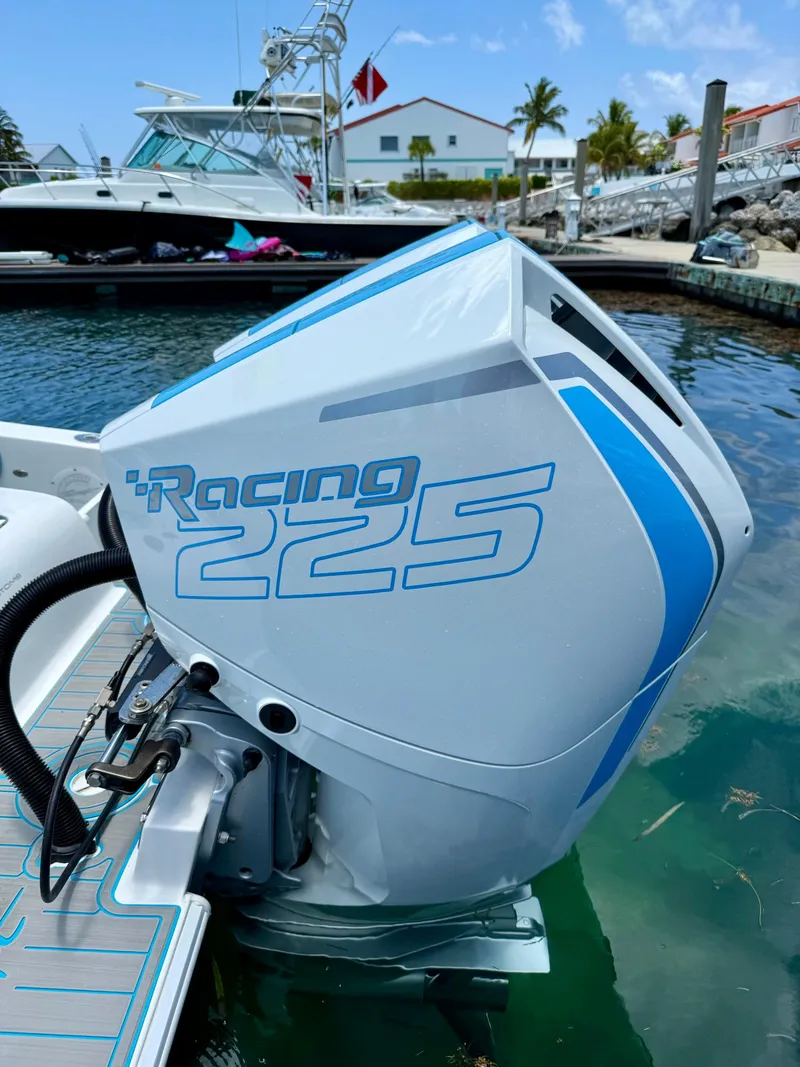 Slide: The Image of Outboard motor labeled "Racing 225" on a 2019 Concept 27' Open Deck boat. - 13
