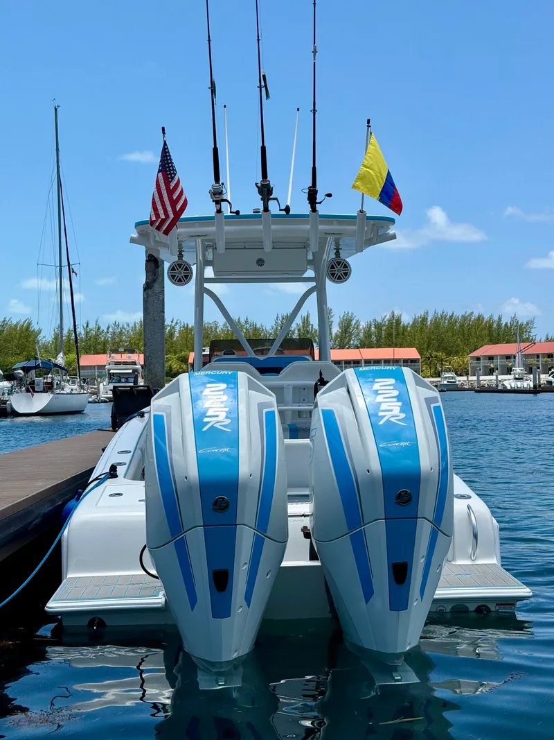 Slide: The Image of 2019 Concept 27' Open Deck boat with dual Mercury 225R engines docked at marina. - 3
