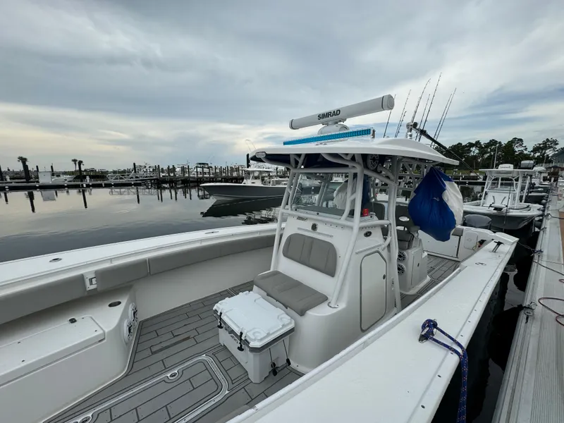 Slide: The Image of 2017 Cape Horn 36 XS boat docked at marina under cloudy sky. - 10