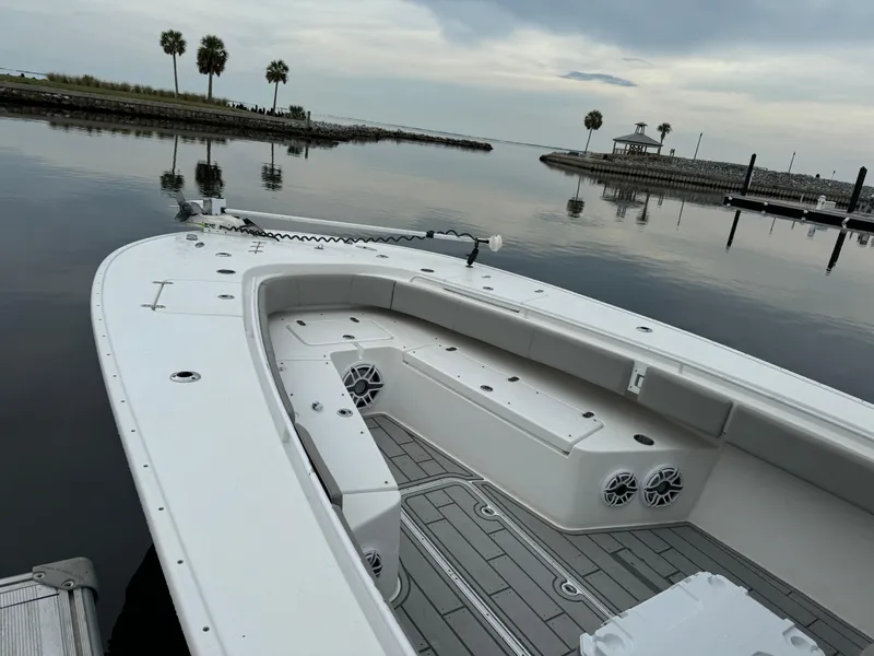 Slide: The Image of 2017 Cape Horn 36 XS boat docked on calm water, scenic view with palm trees. - 5