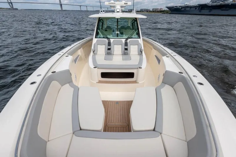 Slide: The Image of Manufacturer Provided Image: 2025 Scout 530 LXF luxury boat interior with spacious seating on open water. - 11