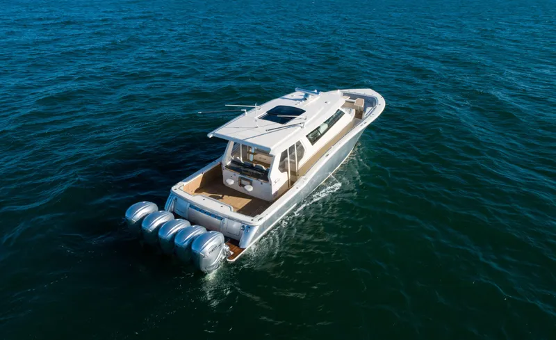 Slide: The Image of 2026 Scout 530 LXF luxury boat cruising on open water. - 2