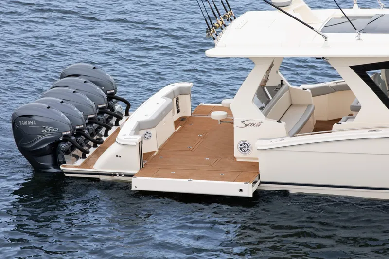 Slide: The Image of 2026 Scout 530 LXF boat with Yamaha XTO engines on water. - 4