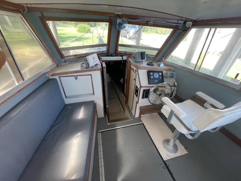 Slide: The Image of Interior of 1995 Stuart Angler 33 Downeast boat with helm and seating area. - 6