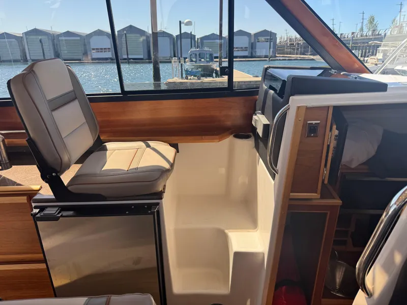 Slide: The Image of Interior of a 2021 Cutwater C-28 boat with seating and waterfront view. - 19