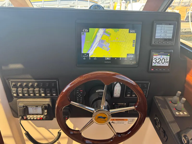 Slide: The Image of Dashboard of a 2021 Cutwater C-28 boat with navigation and control systems. - 22