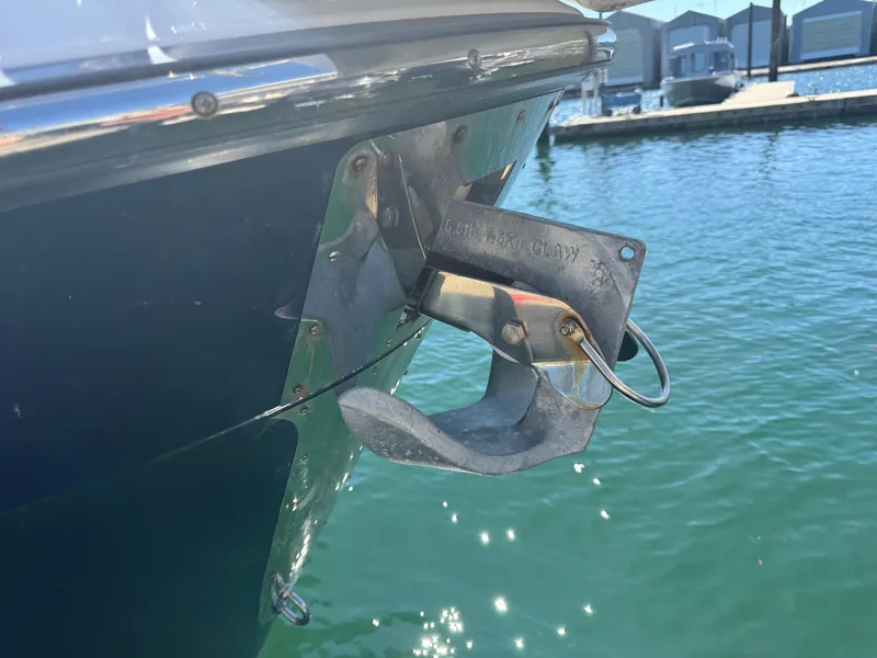 Slide: The Image of 2021 Cutwater C-28 boat anchor detail with water and dock in background. - 44