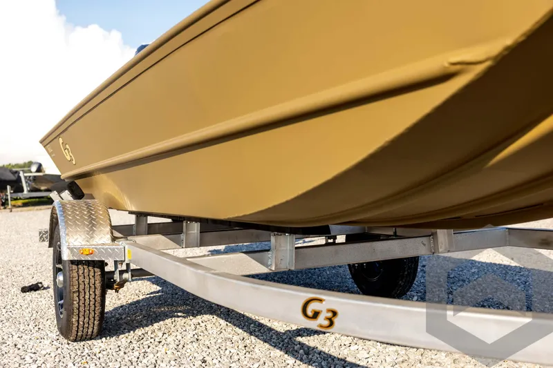 Slide: The Image of 2025 G3 Gator Tough 1652 VBW boat on trailer, close-up view. - 12