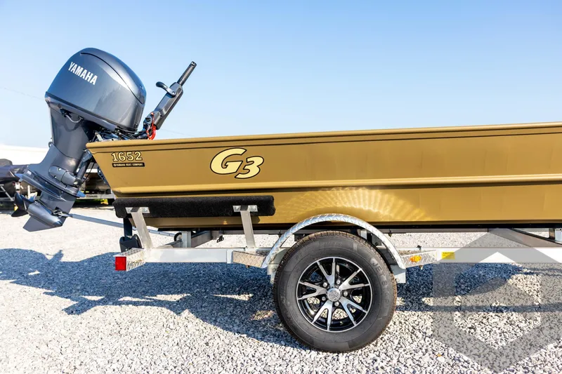 Slide: The Image of 2025 G3 Gator Tough 1652 VBW boat with Yamaha motor on trailer. - 13
