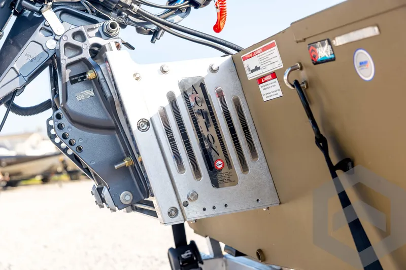 Slide: The Image of 2025 G3 Gator Tough 1652 VBW boat engine detail with metal components and warning labels. - 17