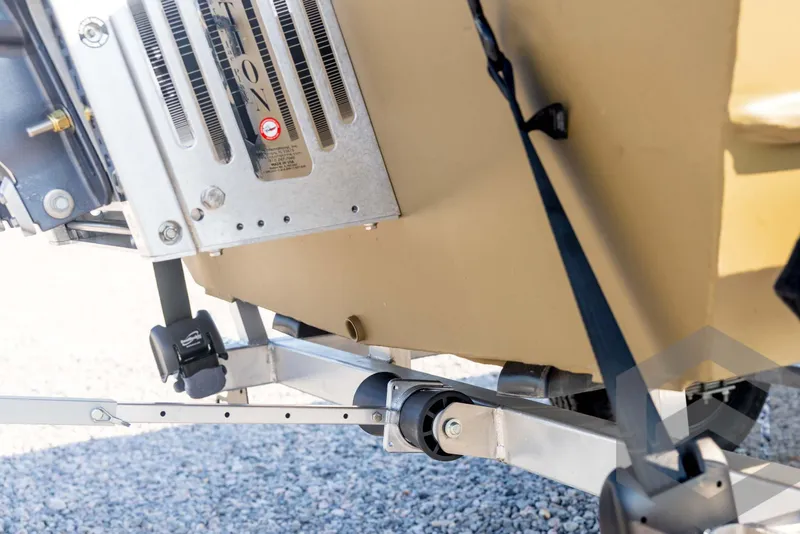 Slide: The Image of 2025 G3 Gator Tough 1652 VBW boat trailer detail with secure strap and metal components. - 18