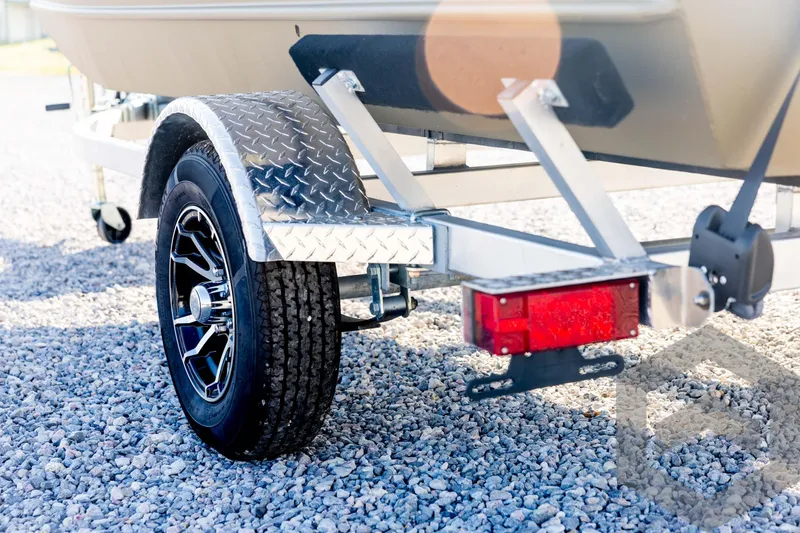 Slide: The Image of 2025 G3 Gator Tough 1652 VBW trailer with diamond plate fender on gravel. - 26