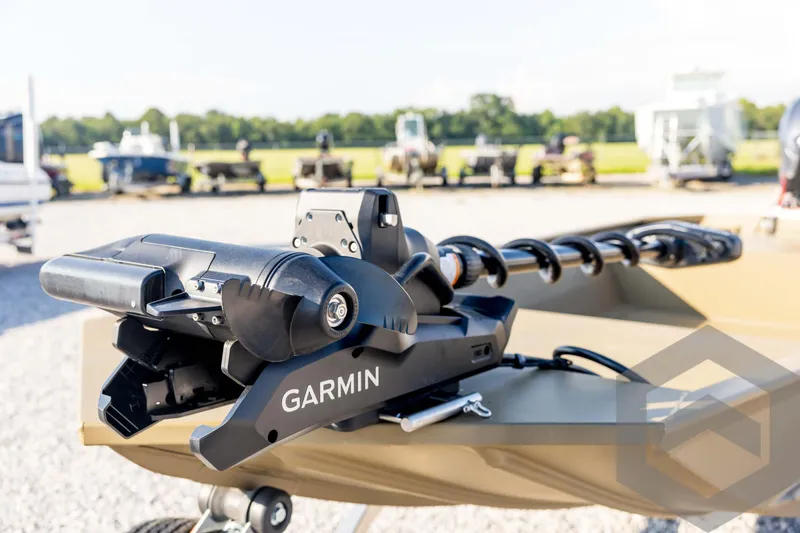 Slide: The Image of 2025 G3 Gator Tough 1652 VBW boat with Garmin trolling motor in outdoor setting. - 29