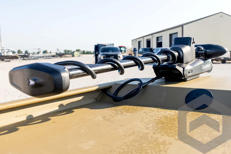 Slide: The Image of 2025 G3 Gator Tough 1652 VBW boat with Garmin trolling motor in outdoor setting. - 31