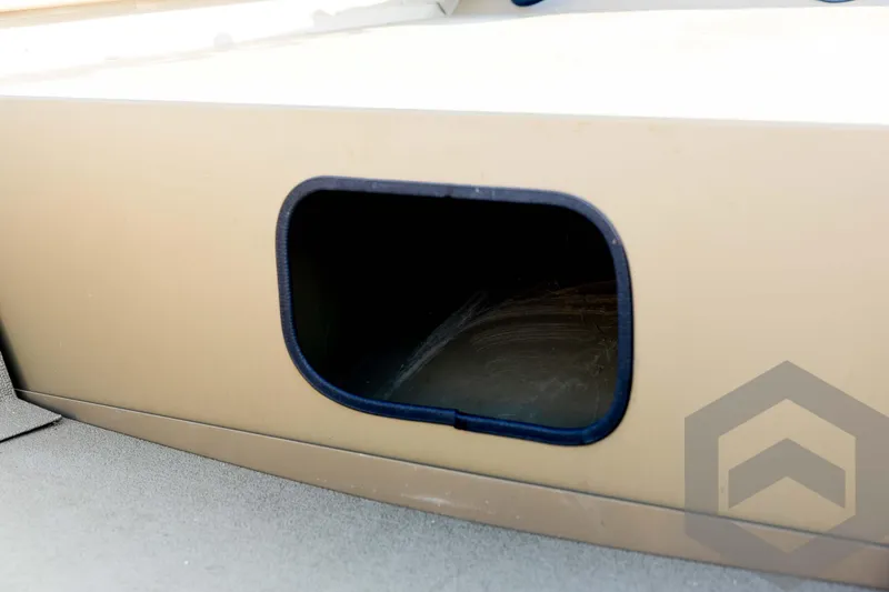 Slide: The Image of 2025 G3 Gator Tough 1652 VBW boat storage compartment, beige exterior. - 33
