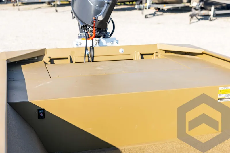 Slide: The Image of 2025 G3 Gator Tough 1652 VBW boat with motor, beige deck, outdoor setting. - 37