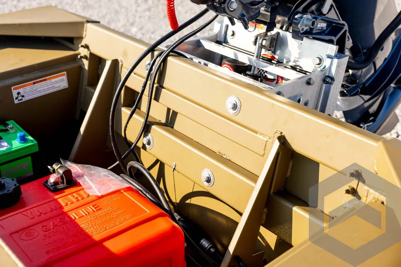 Slide: The Image of Interior view of 2025 G3 Gator Tough 1652 VBW boat with engine components. - 43