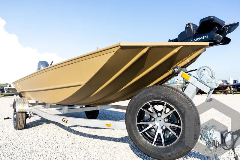 Slide: The Image of 2025 G3 Gator Tough 1652 VBW boat on trailer, featuring Garmin equipment. - 9