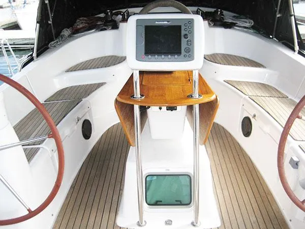 Slide: The Image of Cockpit of 2006 Jeanneau Sun Odyssey 42 DS sailboat with dual steering wheels. - 12