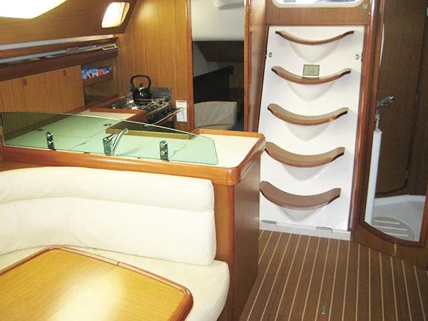 Slide: The Image of Interior of 2006 Jeanneau Sun Odyssey 42 DS sailboat with wood finish and seating area. - 15