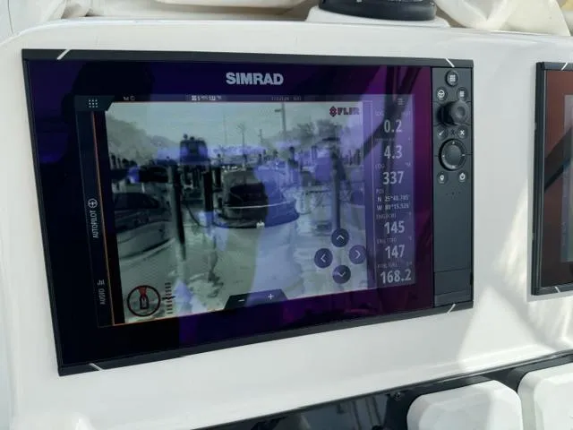 Slide: The Image of Simrad marine display on 2008 Pro-Line 32 Express boat, showing navigation and thermal imaging. - 13