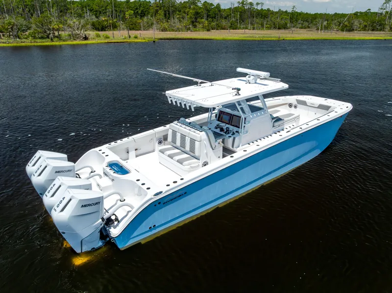 Slide: The Image of 2024 Invincible 37 Catamaran on water, featuring triple Mercury engines. - 14