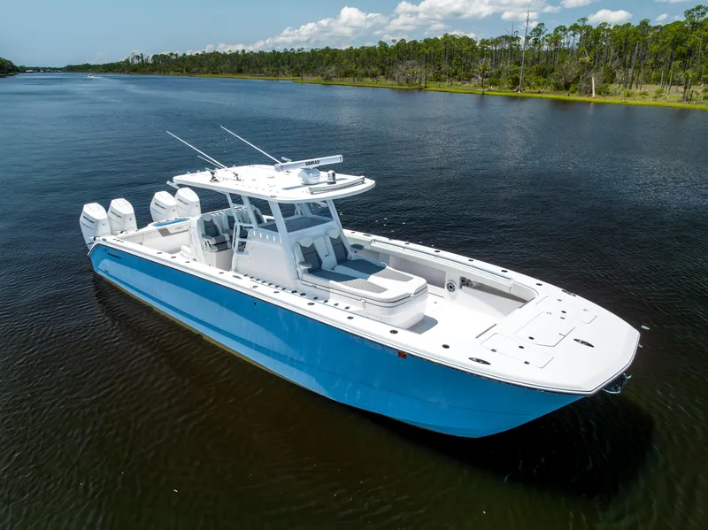 Slide: The Image of 2024 Invincible 37 Catamaran in calm waters, showcasing sleek design and powerful engines. - 16