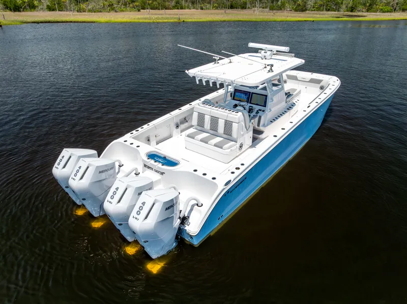 Slide: The Image of 2024 Invincible 37 Catamaran with triple Mercury engines on calm water. - 19