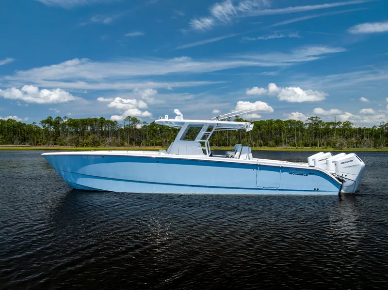 Slide: The Image of 2024 Invincible 37 Catamaran in calm waters, showcasing sleek design and powerful engines. - 3